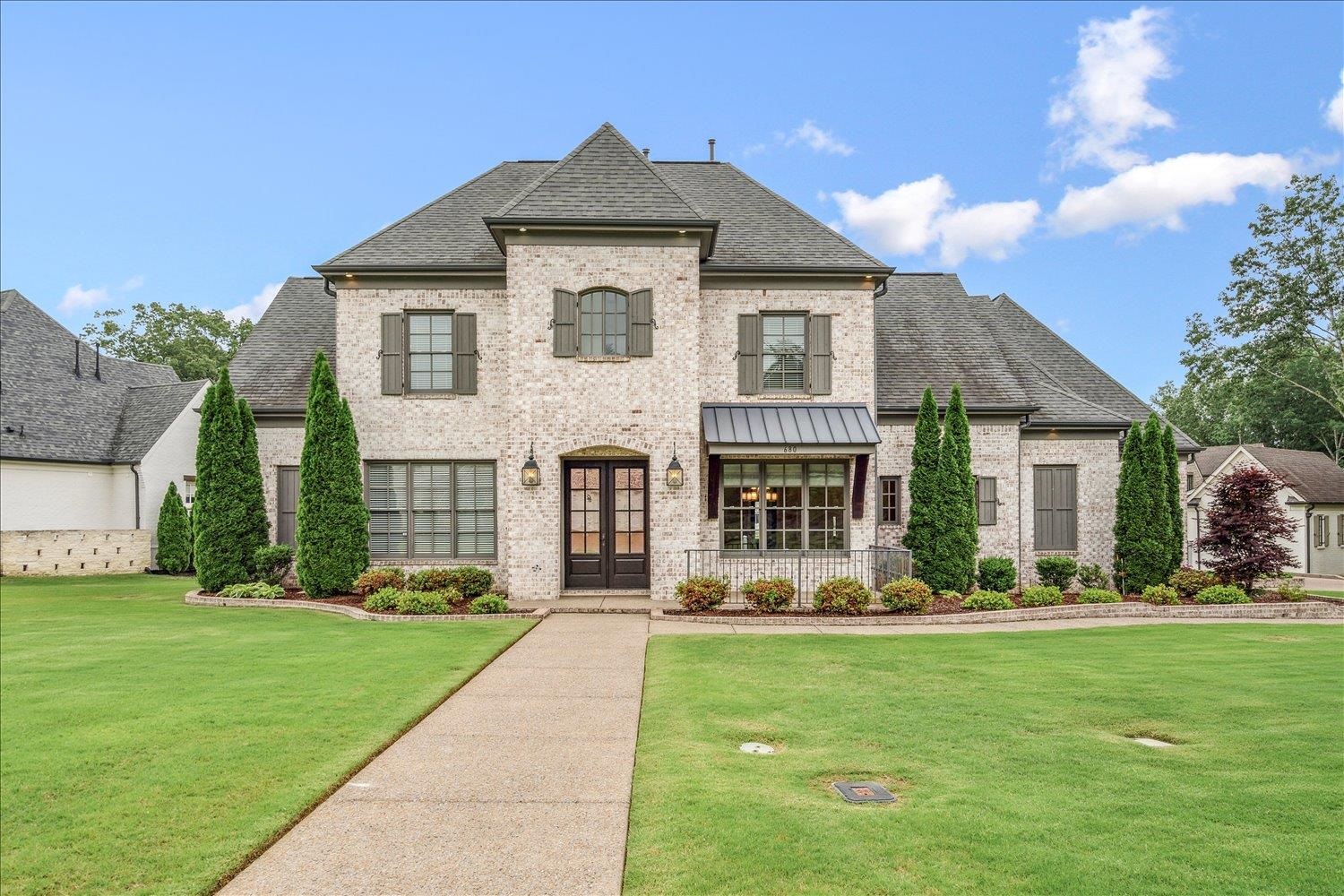 680 Magnolia Lane Piperton, TN 38017 - Photo 1 of 40 French provincial home featuring brick siding, a front lawn, and a shingled roof