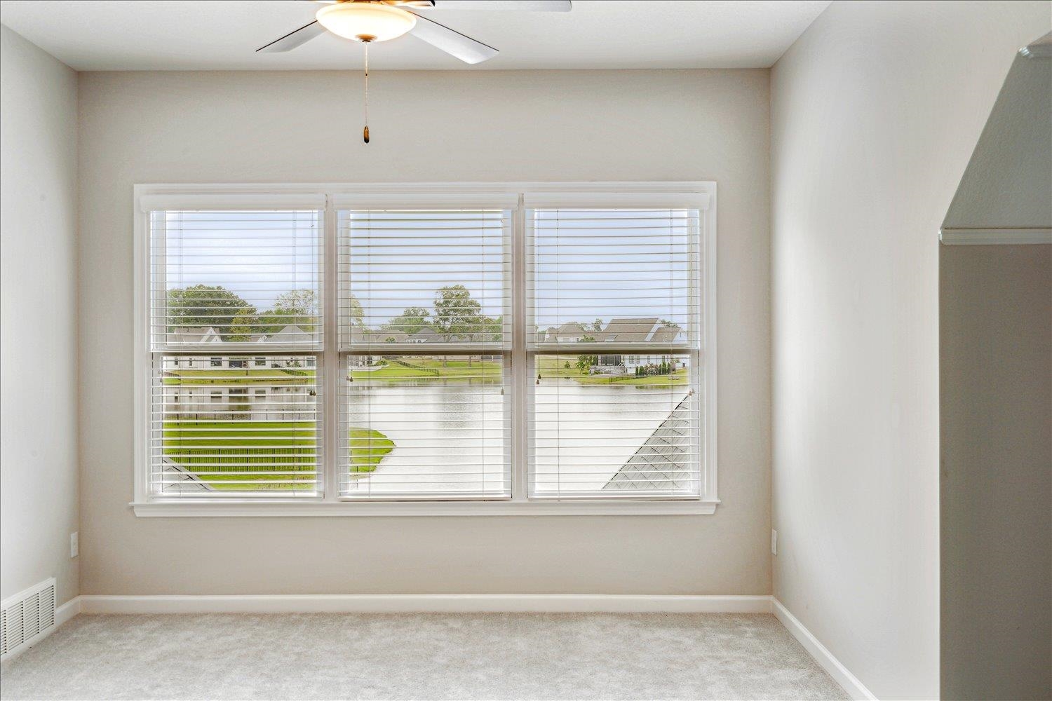 680 Magnolia Lane Piperton, TN 38017 - Photo 30 of 40 Bonus room with light colored carpet, plenty of natural light, and baseboards