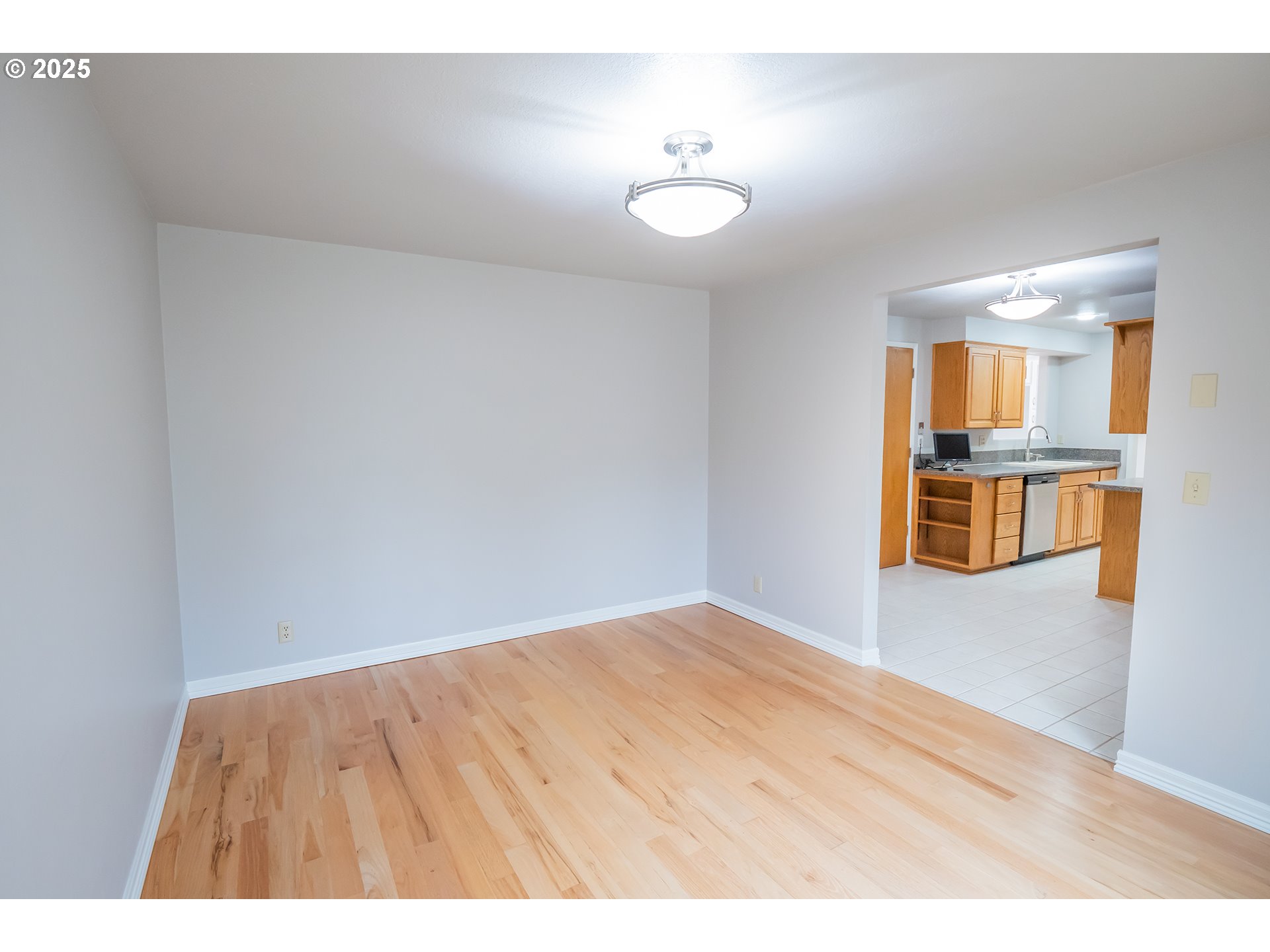 2556 Dumas Drive Springfield, OR 97477 - Photo 11 of 48 a view of empty room with wooden floor