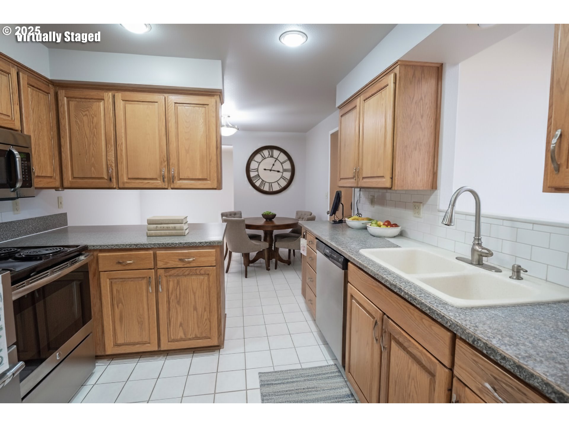 2556 Dumas Drive Springfield, OR 97477 - Photo 14 of 48 a kitchen with stainless steel appliances granite countertop a sink dishwasher stove and cabinets