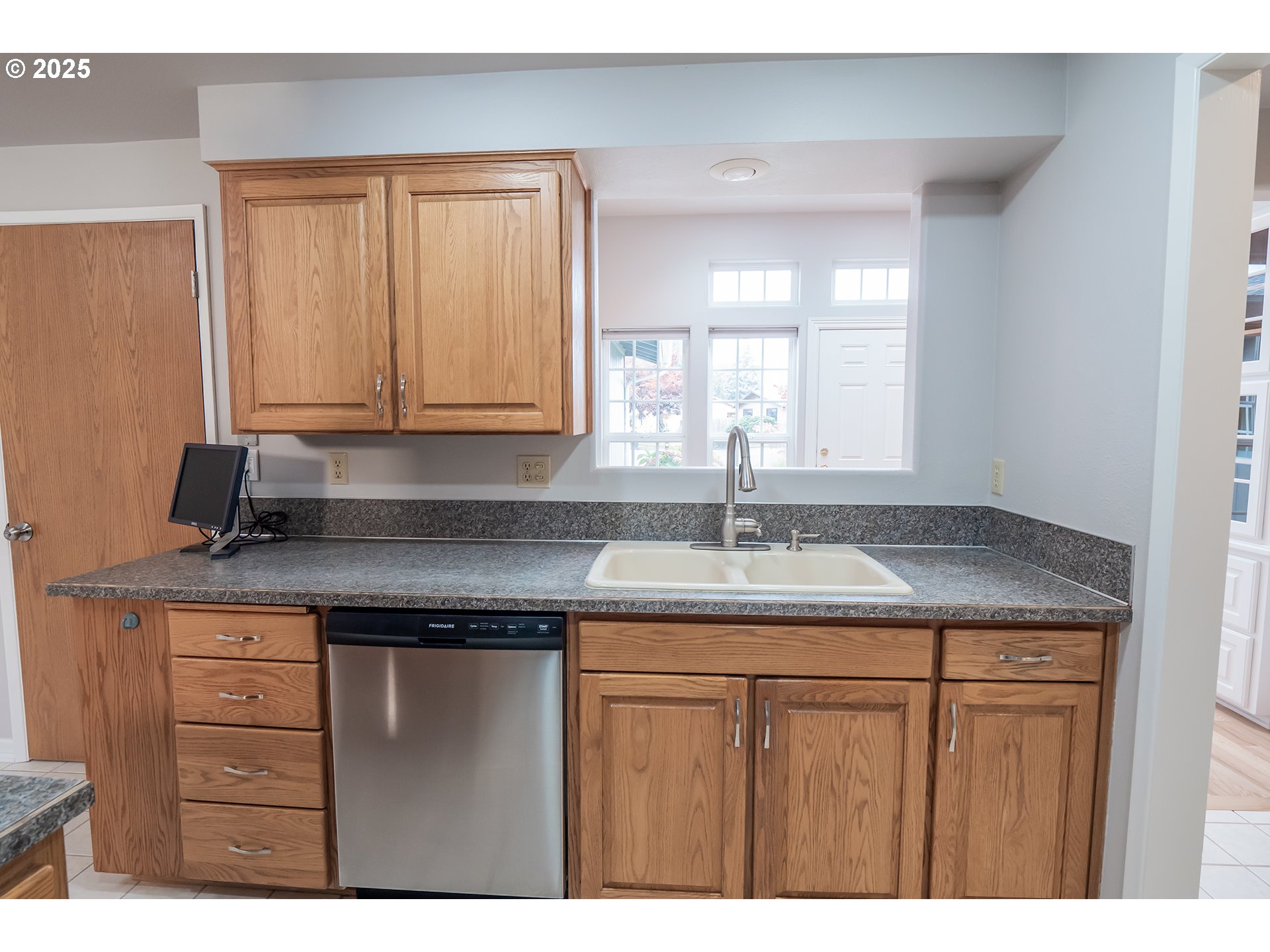 2556 Dumas Drive Springfield, OR 97477 - Photo 15 of 48 a kitchen with a sink a stove and cabinets