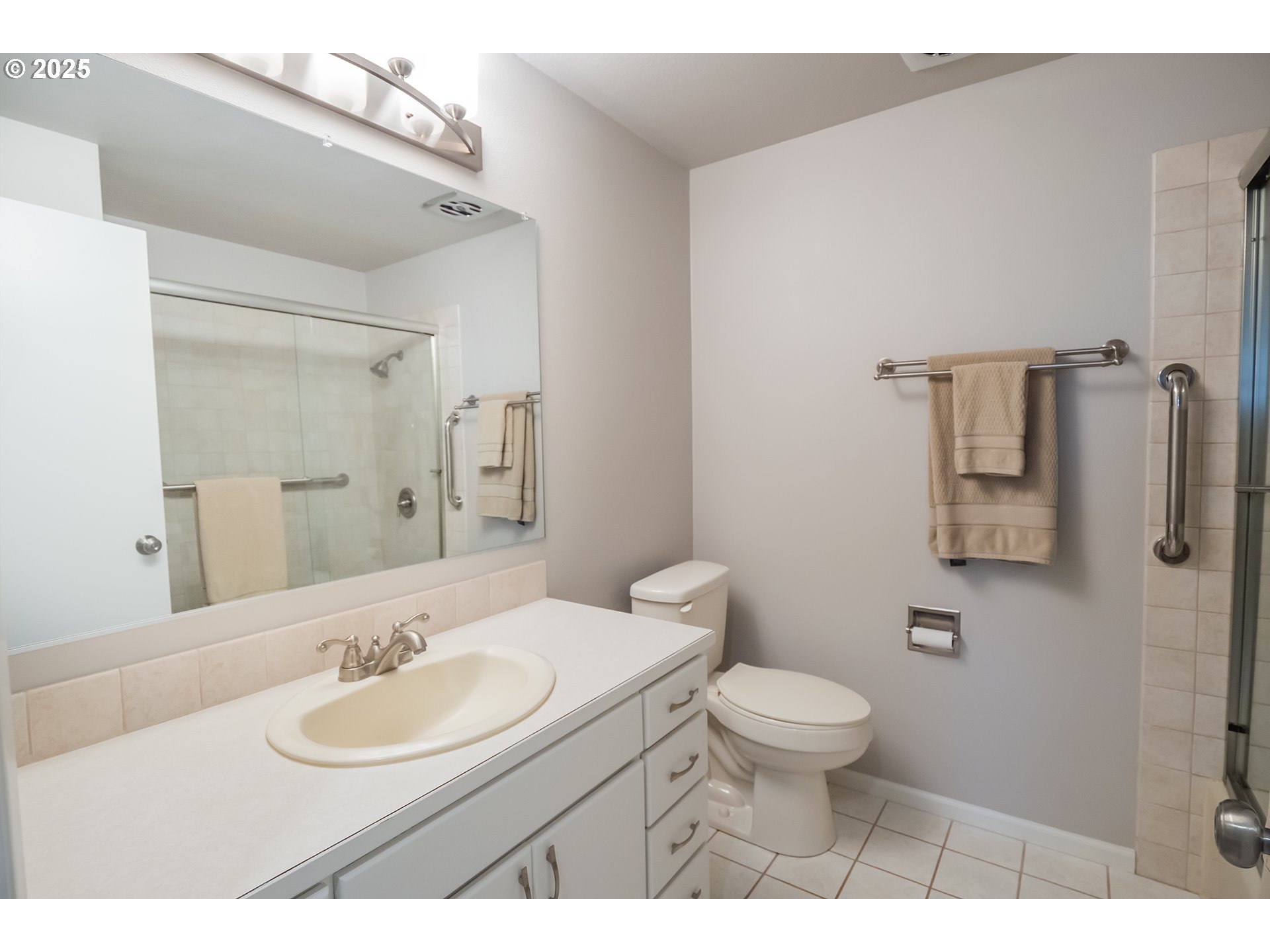 2556 Dumas Drive Springfield, OR 97477 - Photo 24 of 48 a bathroom with a sink a toilet a mirror and vanity