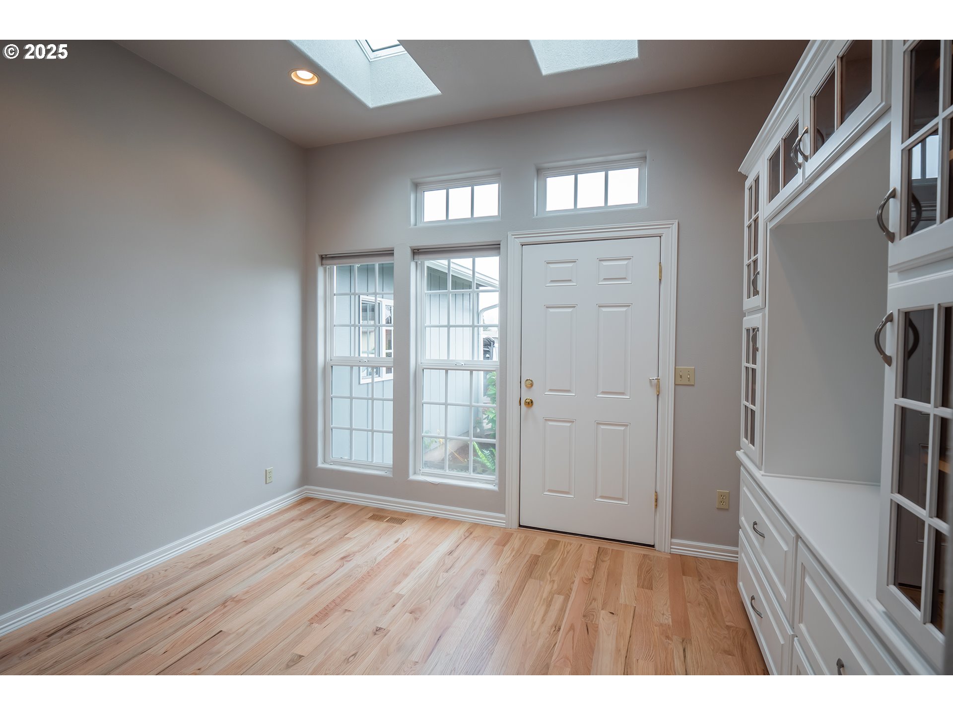 2556 Dumas Drive Springfield, OR 97477 - Photo 3 of 48 view of an empty room with wooden floor and a window