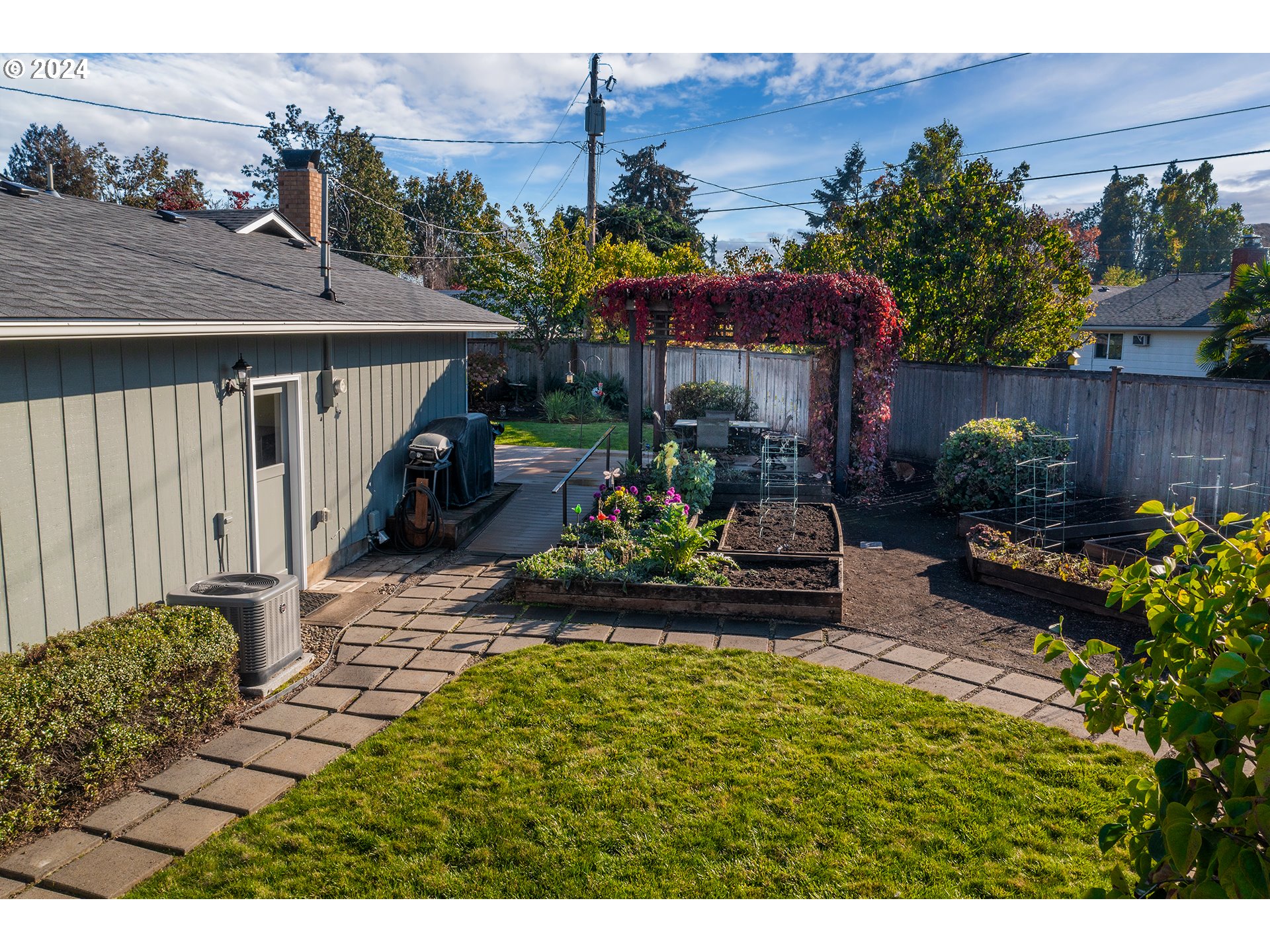 2556 Dumas Drive Springfield, OR 97477 - Photo 40 of 48 a view of a house with sitting area and a garden