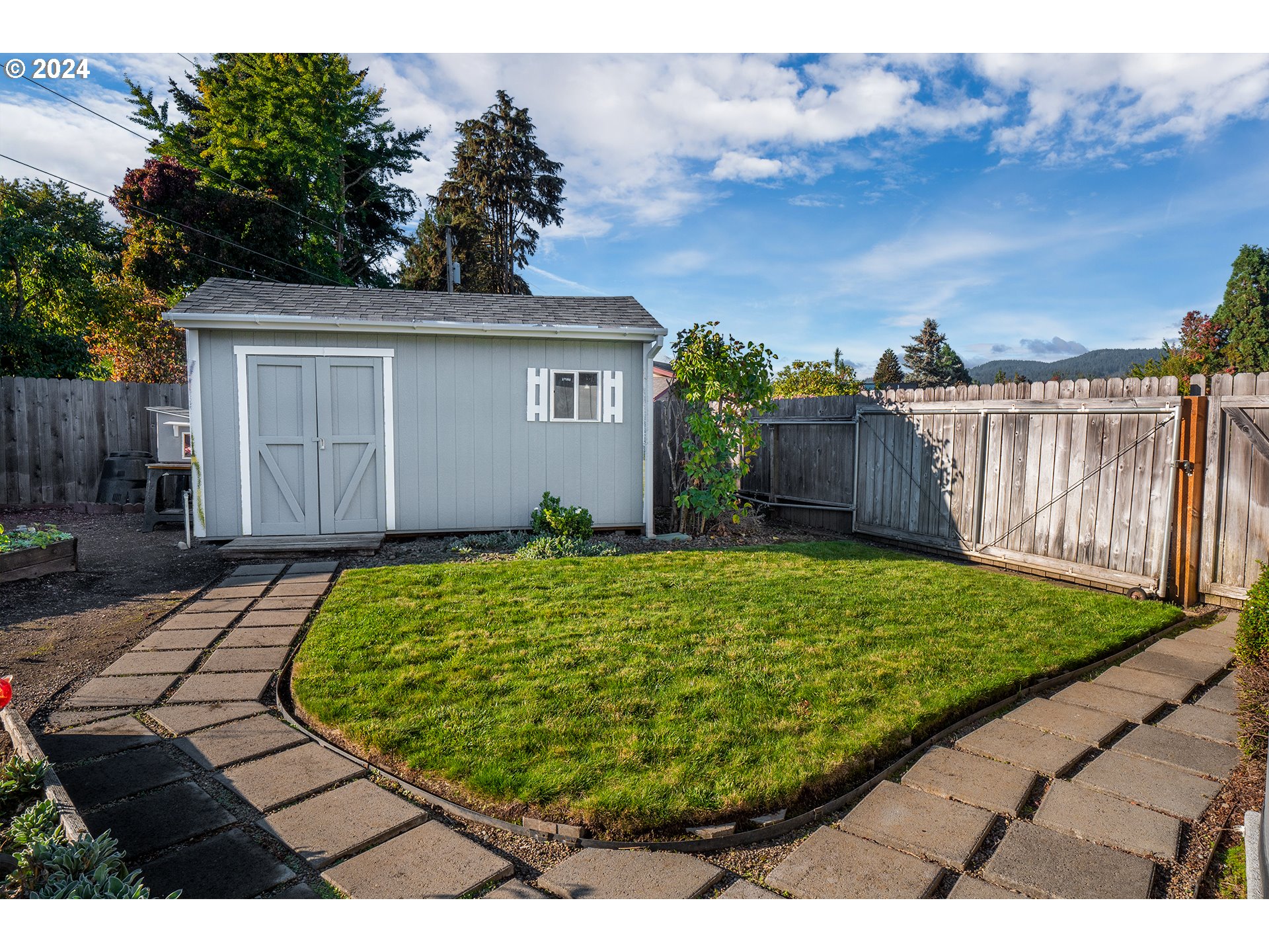 2556 Dumas Drive Springfield, OR 97477 - Photo 44 of 48 a view of a backyard with a garden