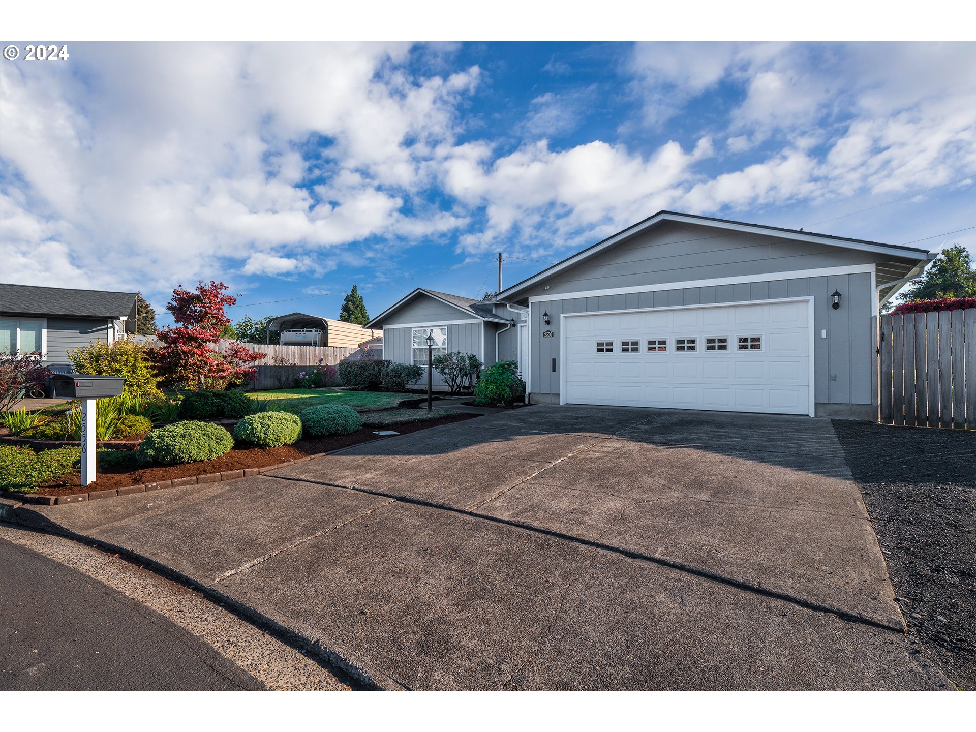 2556 Dumas Drive Springfield, OR 97477 - Photo 46 of 48 a view of a house with a yard and plants