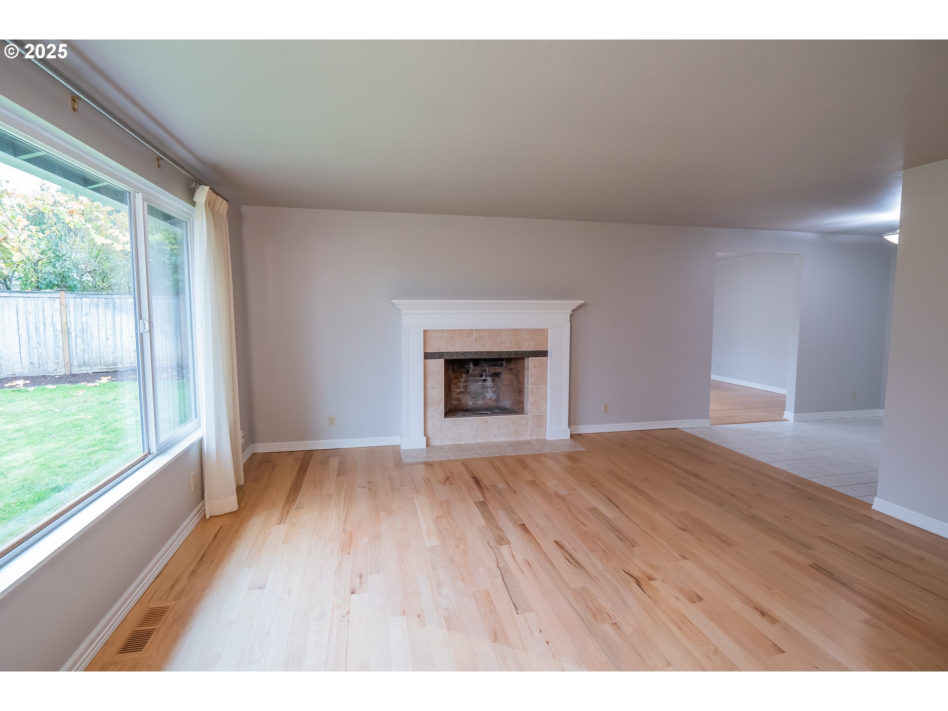 2556 Dumas Drive Springfield, OR 97477 - Photo 10 of 48 a view of an empty room with wooden floor and a window