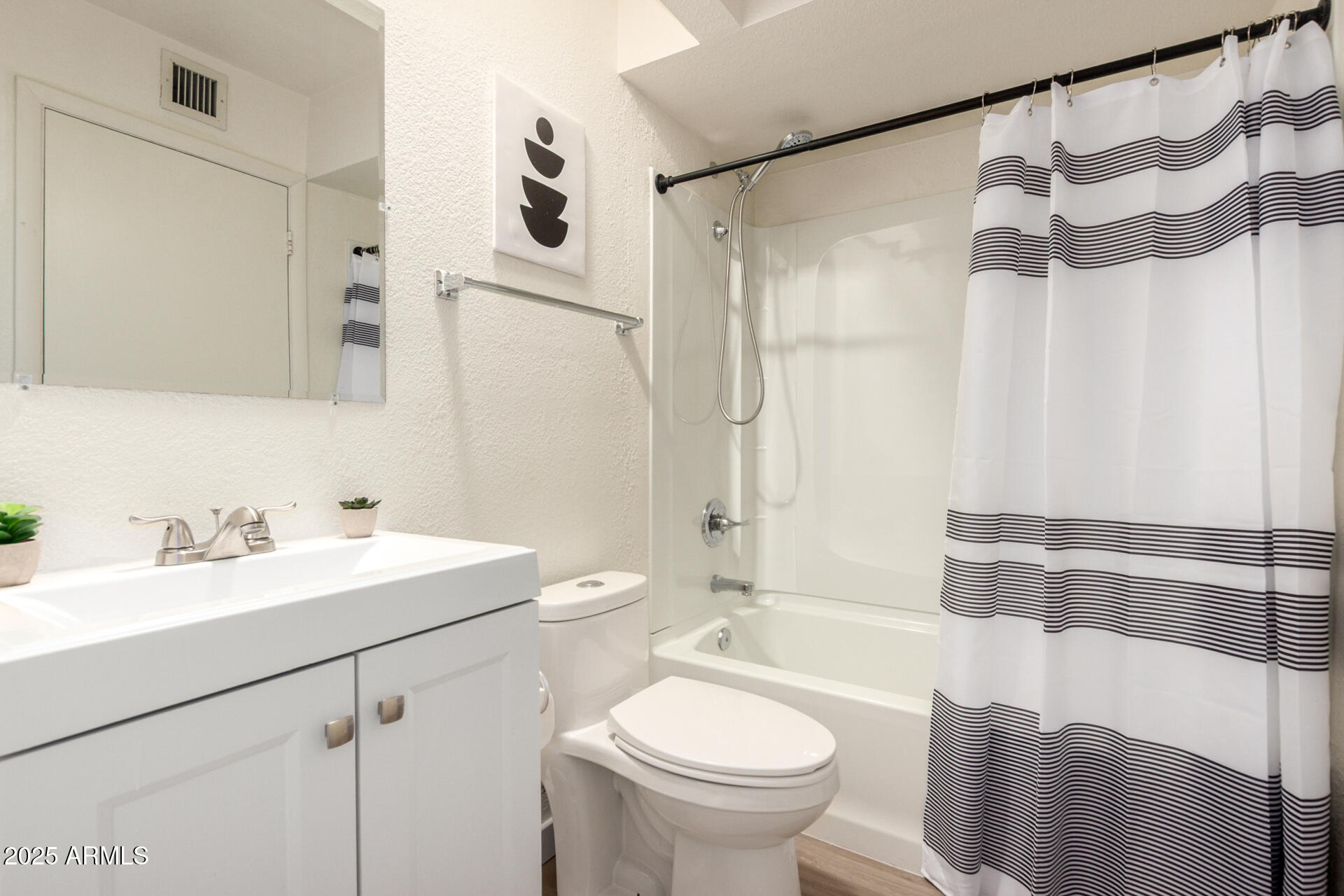 700 East Mesquite Circle, Unit L107 Tempe, AZ 85288 - Photo 14 of 26 a bathroom with a sink and a mirror