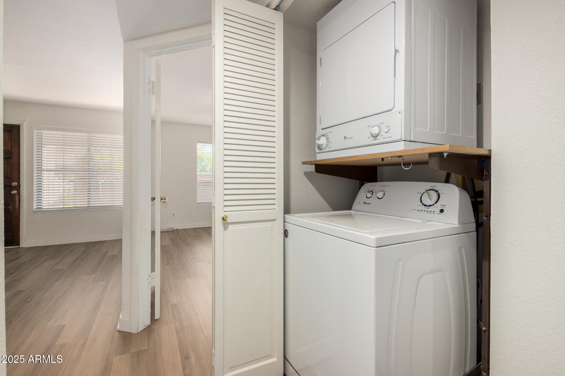700 East Mesquite Circle, Unit L107 Tempe, AZ 85288 - Photo 21 of 26 a utility room with dryer and washer