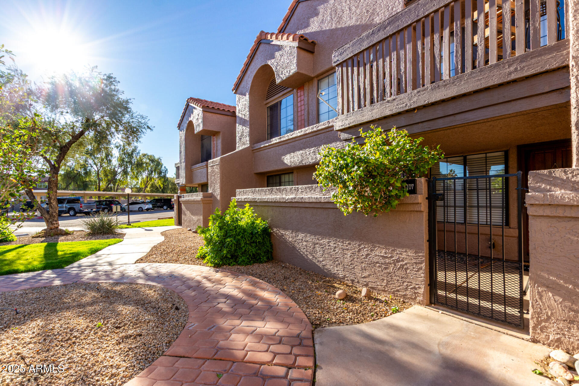 700 East Mesquite Circle, Unit L107 Tempe, AZ 85288 - Photo 22 of 26 a view of a house with a yard