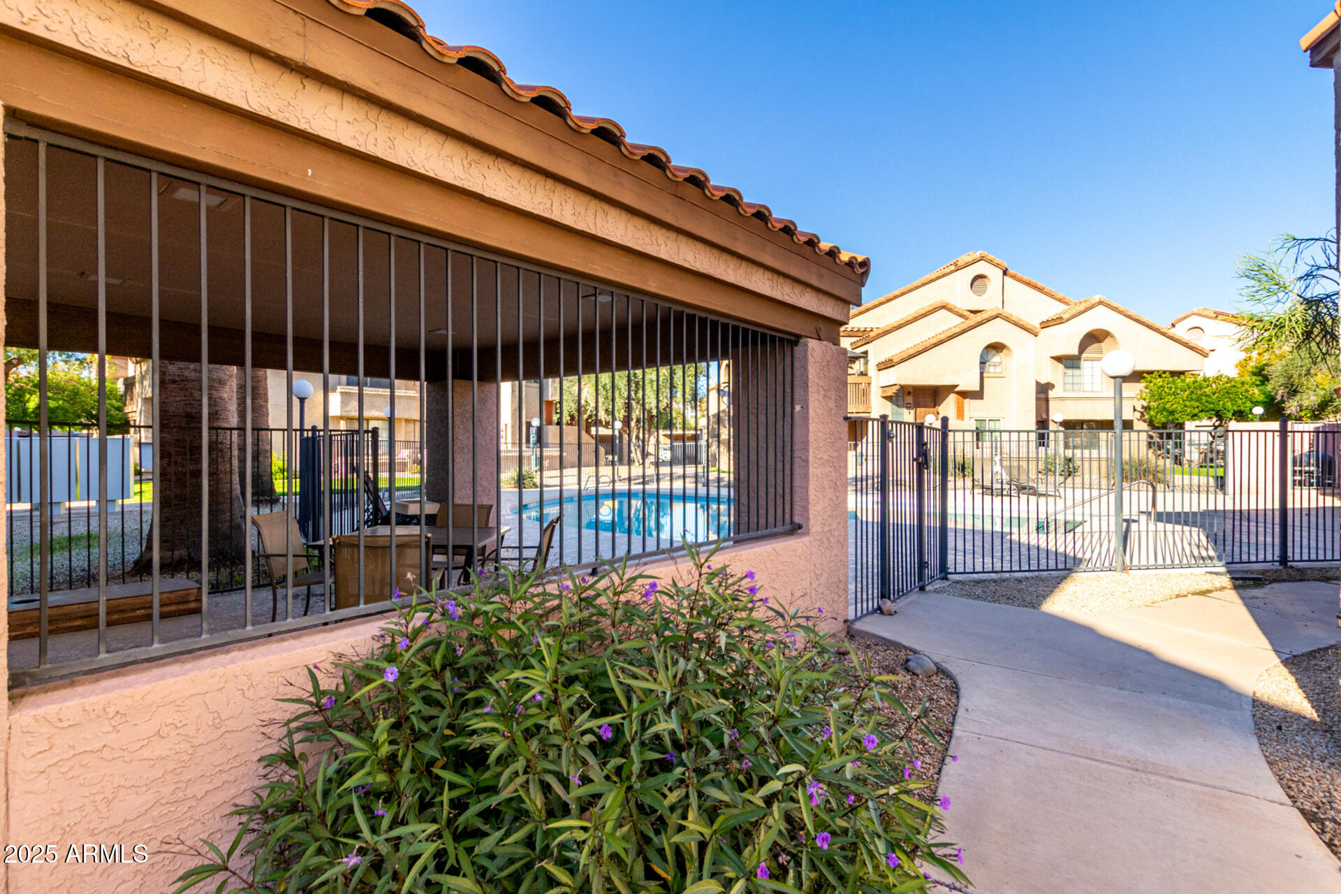 700 East Mesquite Circle, Unit L107 Tempe, AZ 85288 - Photo 24 of 26 a view of a house with backyard and porch