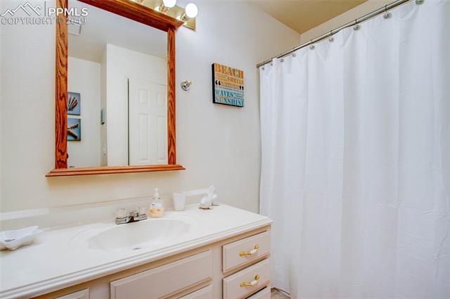 4827 Del Sol Road Colorado Springs, CO 80918 - Photo 15 of 24 The full upper level bathroom shared by the 2nd and 3rd bedrooms.