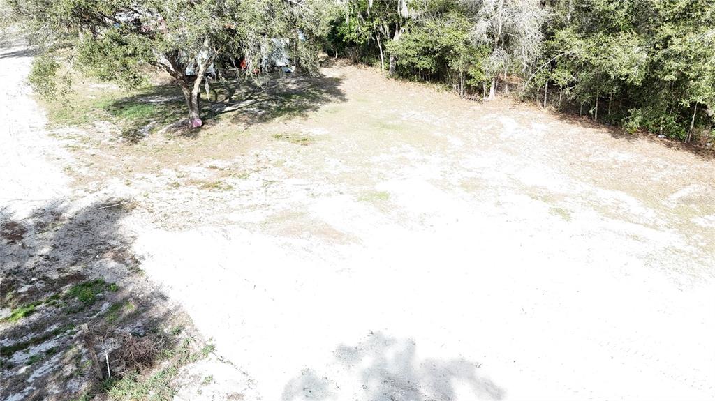 12510 Robinhood Road Hudson, FL 34669 - Photo 2 of 12 a view of a yard covered in snow