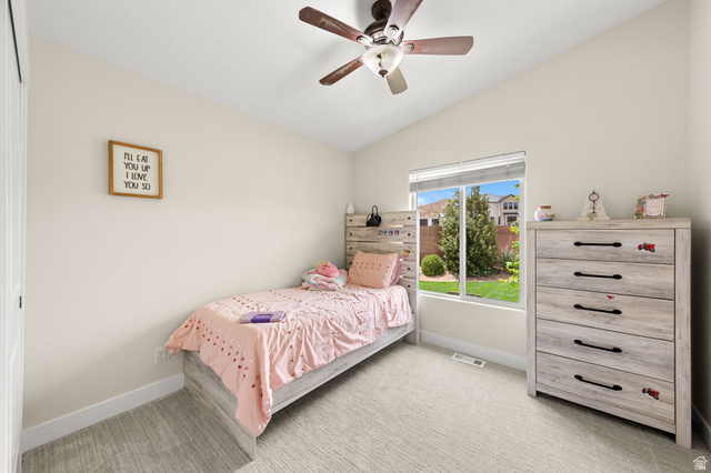 2591 East Washington Dam Road Washington, UT 84780 - Photo 37 of 67 Interior room featuring an angled ceiling, a ceiling fan with wood-finish blades, and neutral-toned carpeting