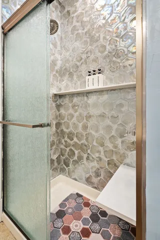 a bathroom with a bathtub and a shower