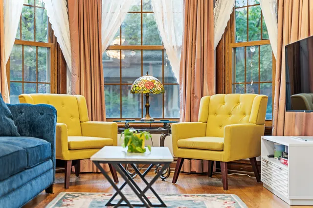 a living room with furniture and a large window