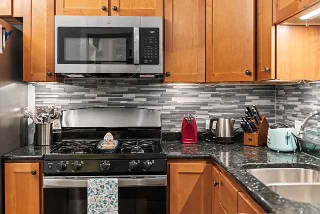 a kitchen with a stove and a sink