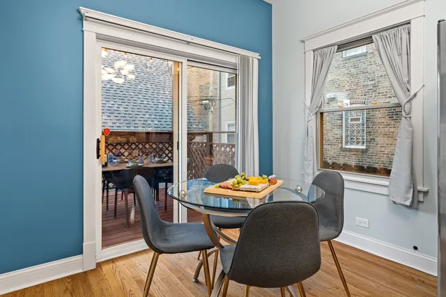 a view of a dining room with furniture window and wooden floor