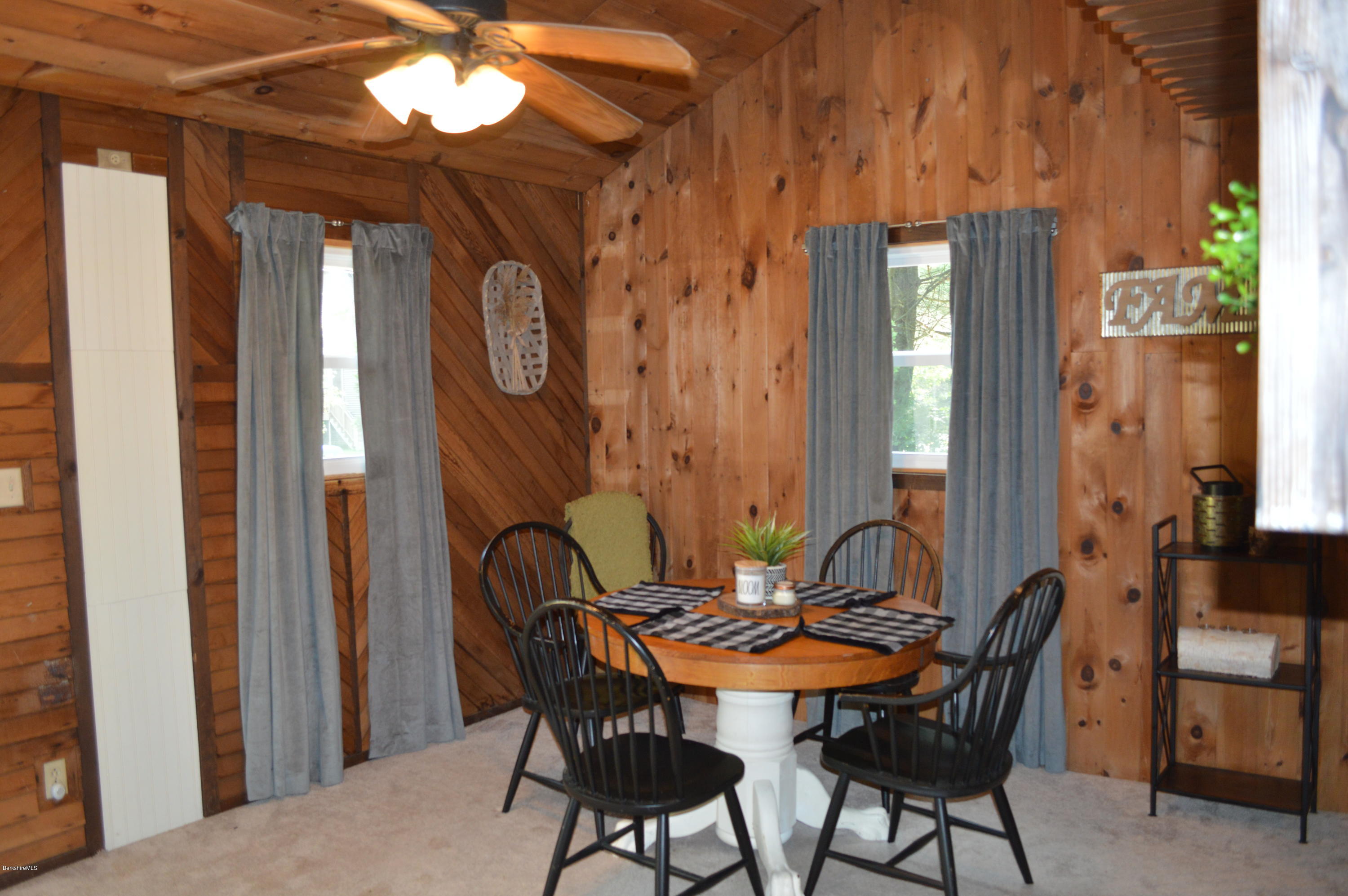 76 Shawnee Shore Road Becket, MA 01223 - Photo 8 of 30 a view of a dining room with furniture and window