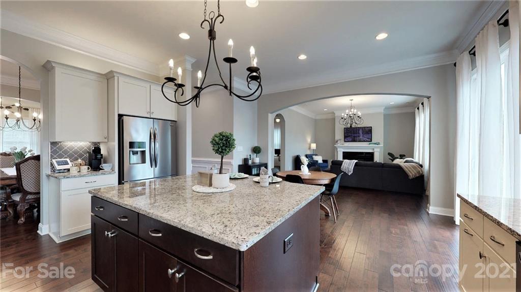 1000 Fallondale Road Waxhaw, NC 28173 - Photo 17 of 48 a kitchen with stainless steel appliances granite countertop living room and living room