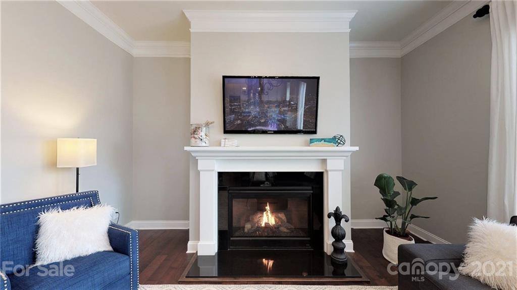 1000 Fallondale Road Waxhaw, NC 28173 - Photo 22 of 48 a living room with furniture a fireplace and a wooden floor