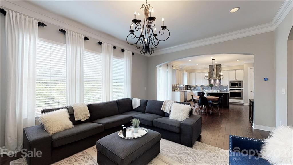 1000 Fallondale Road Waxhaw, NC 28173 - Photo 23 of 48 a living room with furniture chandelier and a large window