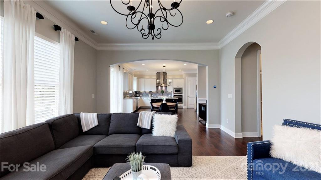 1000 Fallondale Road Waxhaw, NC 28173 - Photo 24 of 48 a living room with furniture or couch and a chandelier