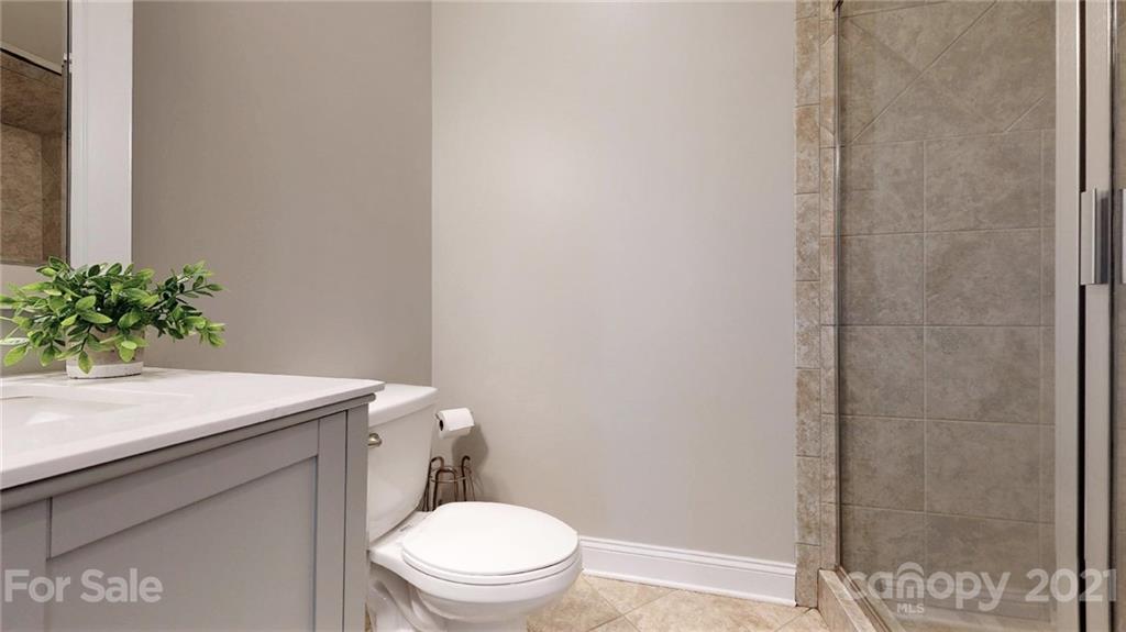 1000 Fallondale Road Waxhaw, NC 28173 - Photo 26 of 48 a bathroom with a sink a toilet and shower