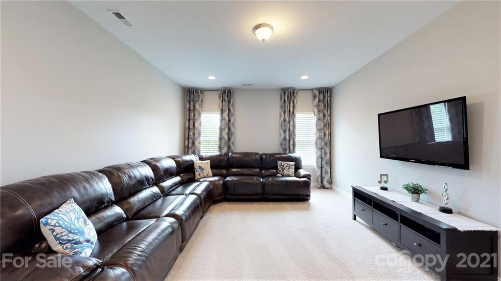 1000 Fallondale Road Waxhaw, NC 28173 - Photo 34 of 48 a living room with furniture and a flat screen tv