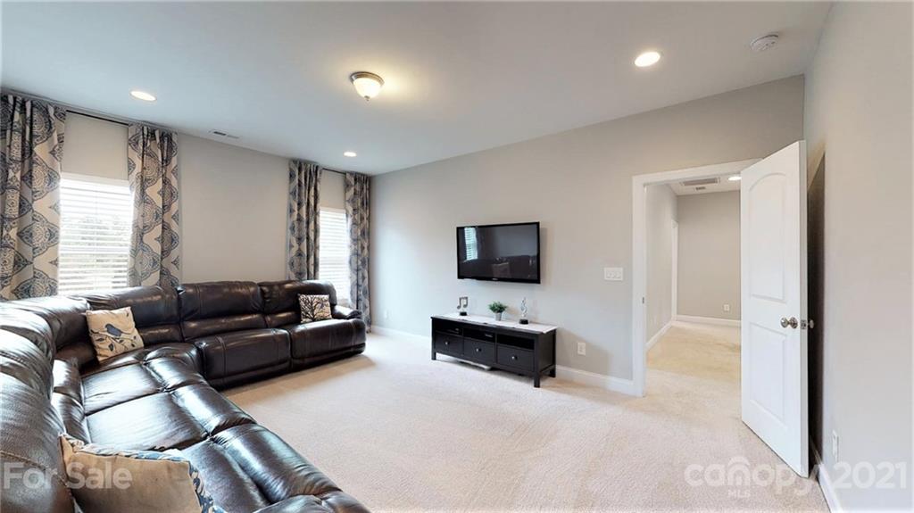 1000 Fallondale Road Waxhaw, NC 28173 - Photo 35 of 48 a living room with furniture and a flat screen tv