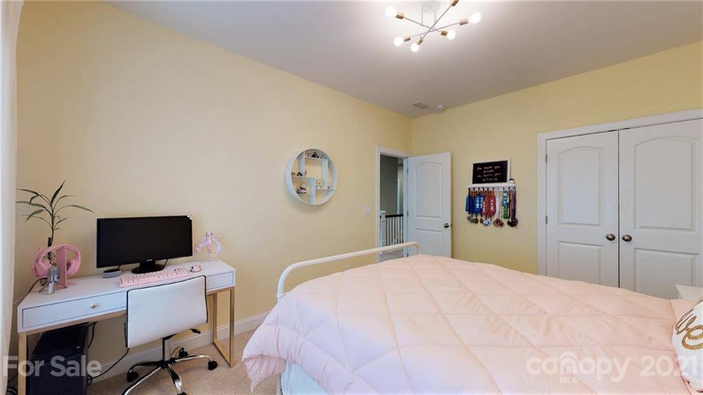 1000 Fallondale Road Waxhaw, NC 28173 - Photo 41 of 48 a bedroom with a bed and a flat screen tv