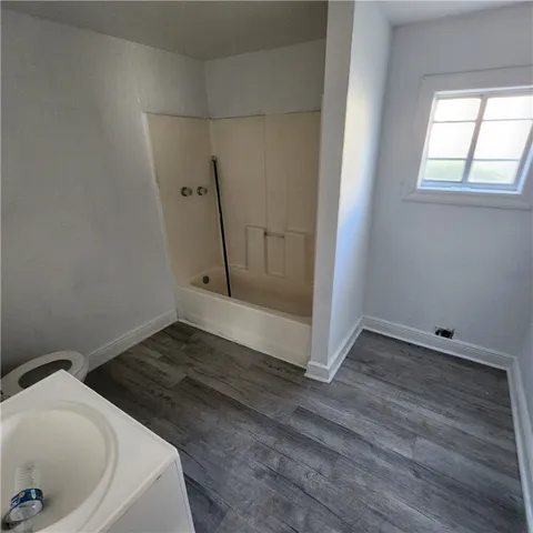 a bathroom with a sink and shower