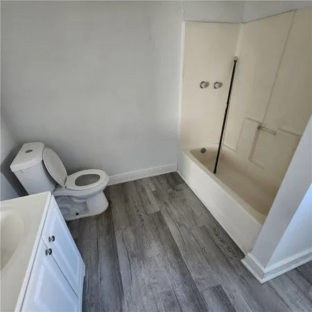 a bathroom with a toilet and a sink