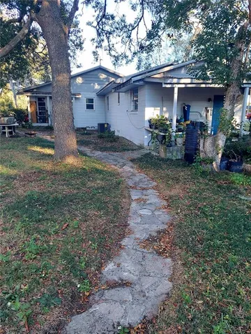 a front view of house with a yard