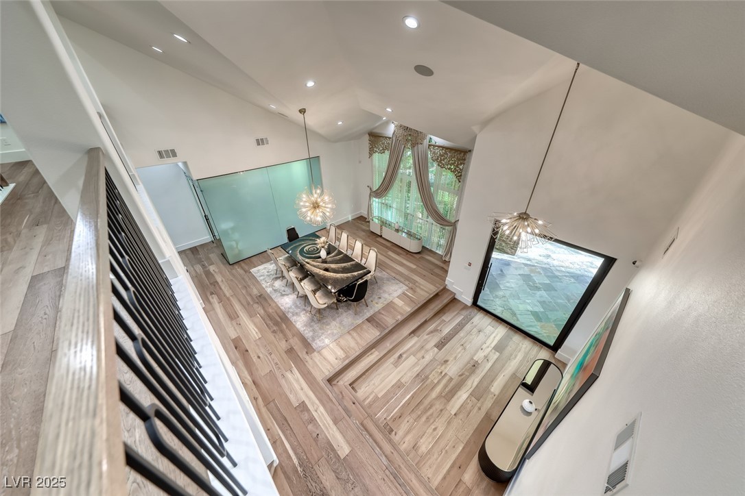2309 Prometheus Court Henderson, NV 89074 - Photo 24 of 86 Living room with high vaulted ceiling, wood finished floors, recessed lighting, and a chandelier