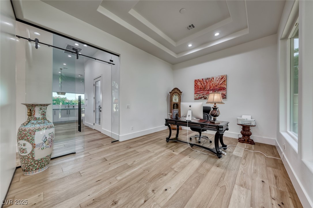 2309 Prometheus Court Henderson, NV 89074 - Photo 27 of 86 Office space with light wood-style flooring, a raised ceiling, and recessed lighting
