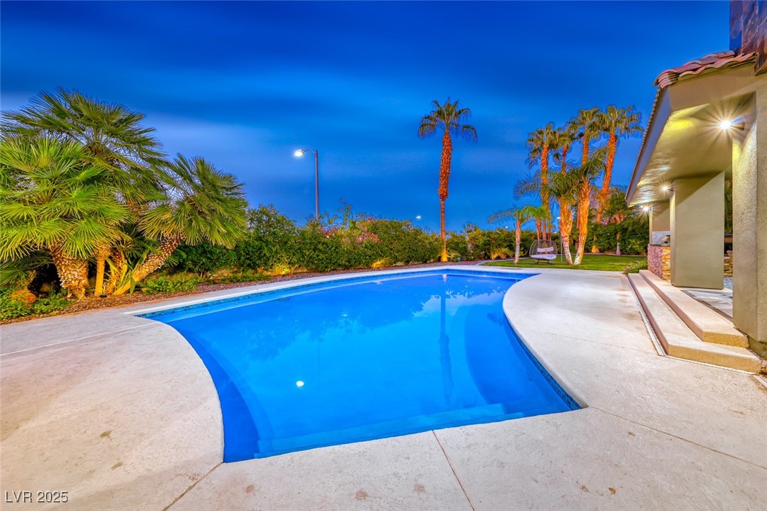2309 Prometheus Court Henderson, NV 89074 - Photo 66 of 86 Pool at night with an outdoor pool and a patio area