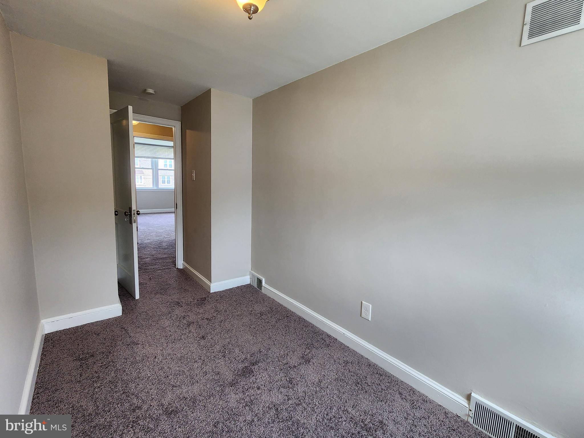 201 Westbridge Road Glenolden, PA 19036 - Photo 12 of 24 an empty room with a hallway and mirror