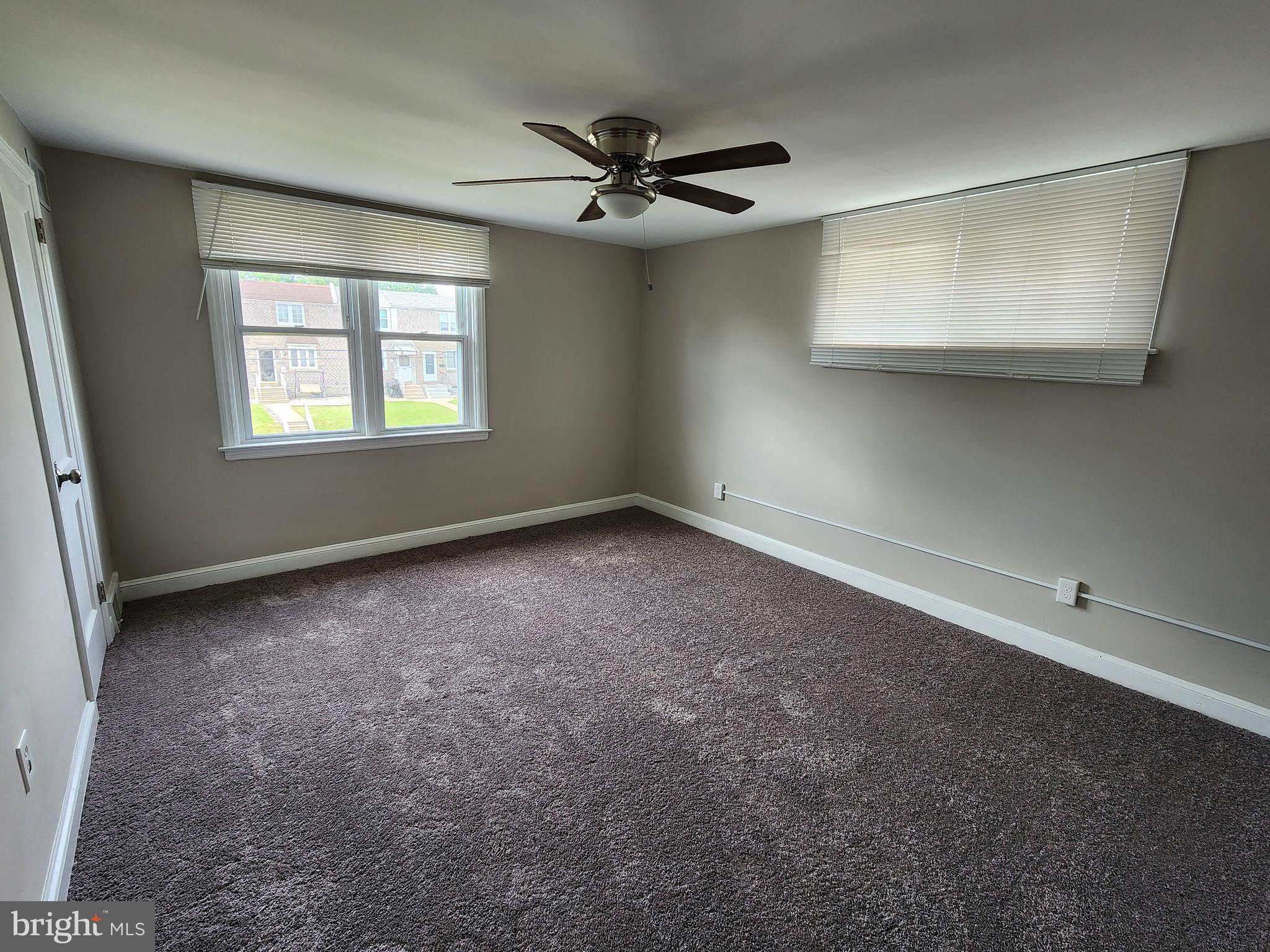 201 Westbridge Road Glenolden, PA 19036 - Photo 9 of 24 an empty room with a ceiling fan and window