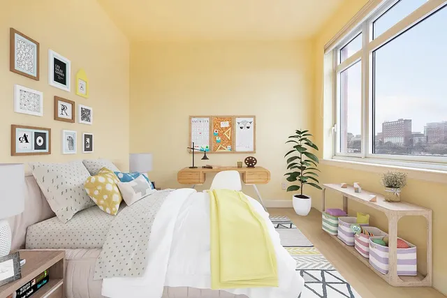 a spacious bedroom with a bed and a couch