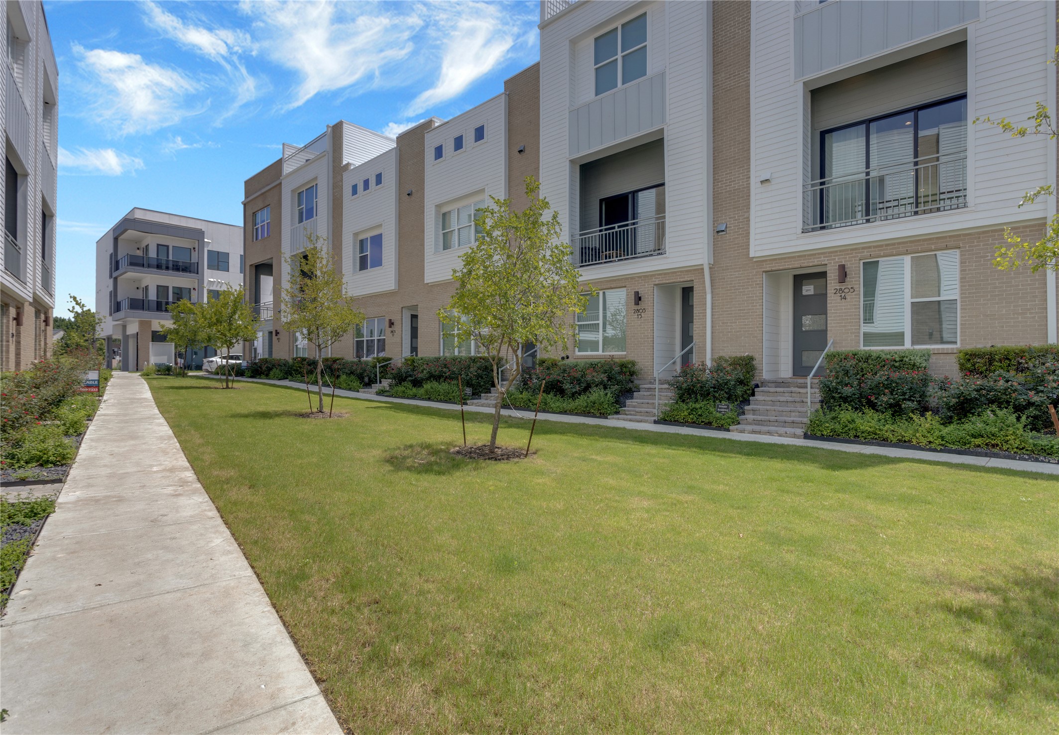 2805 McCurdy Street, Unit 14 Austin, TX 78723 - Photo 2 of 40 Contemporary facades and verdant lawns welcome you home to this stylish townhome community.