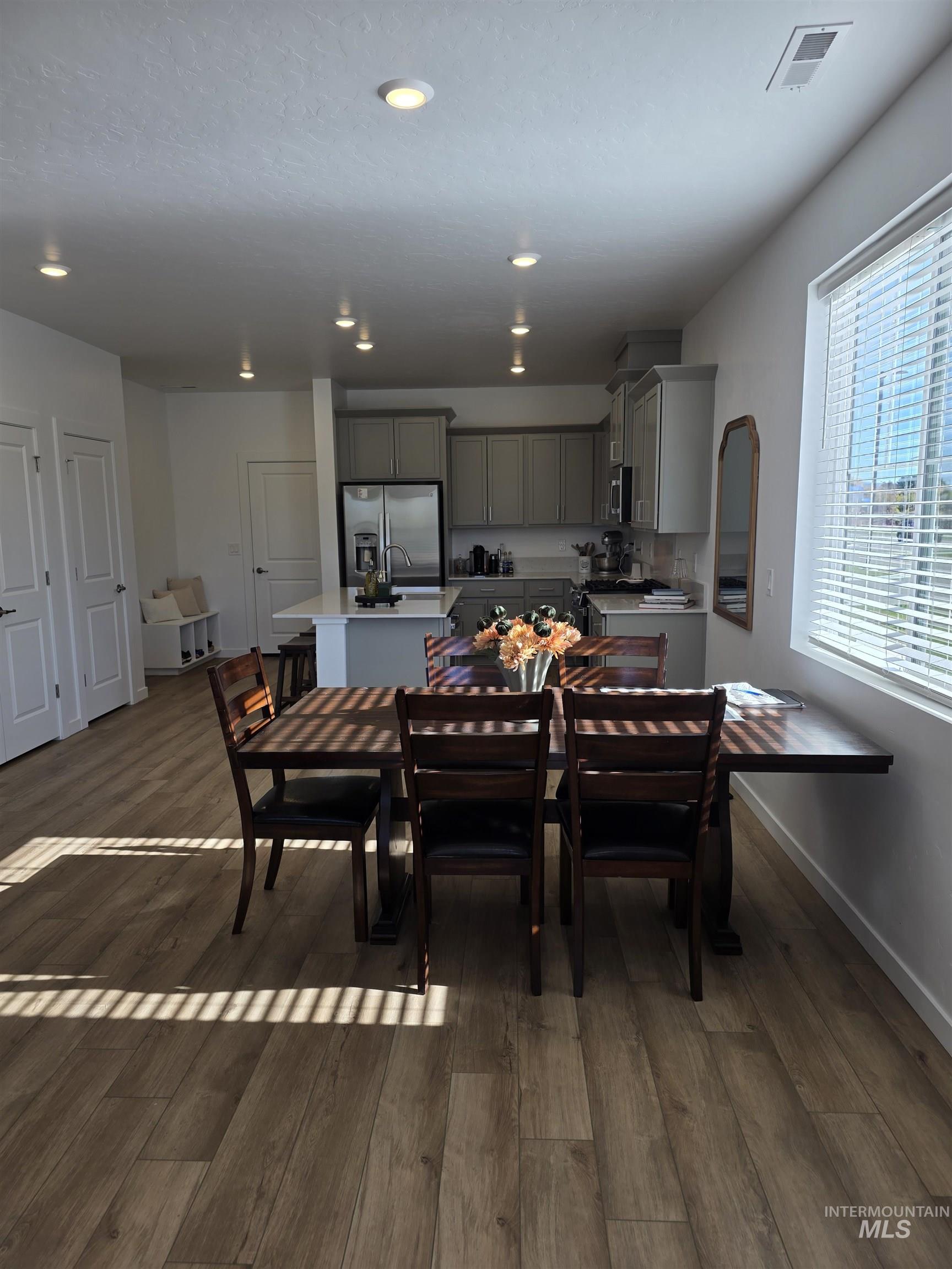 168 North Stratus Way Eagle, ID 83616 - Photo 10 of 35 Dining space with dark wood-style flooring and recessed lighting