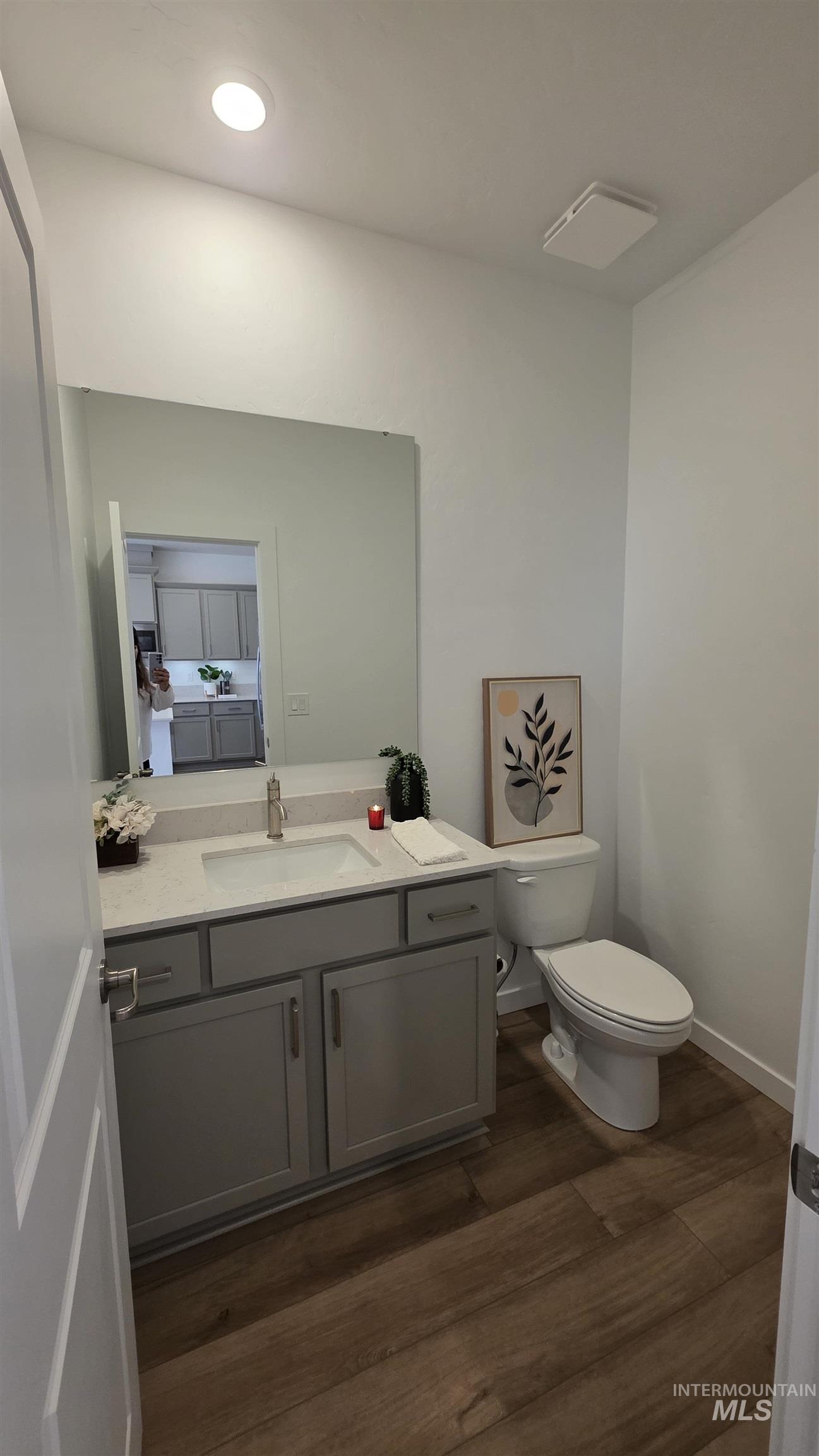 168 North Stratus Way Eagle, ID 83616 - Photo 14 of 35 Half bathroom featuring vanity, dark wood-type flooring, and recessed lighting