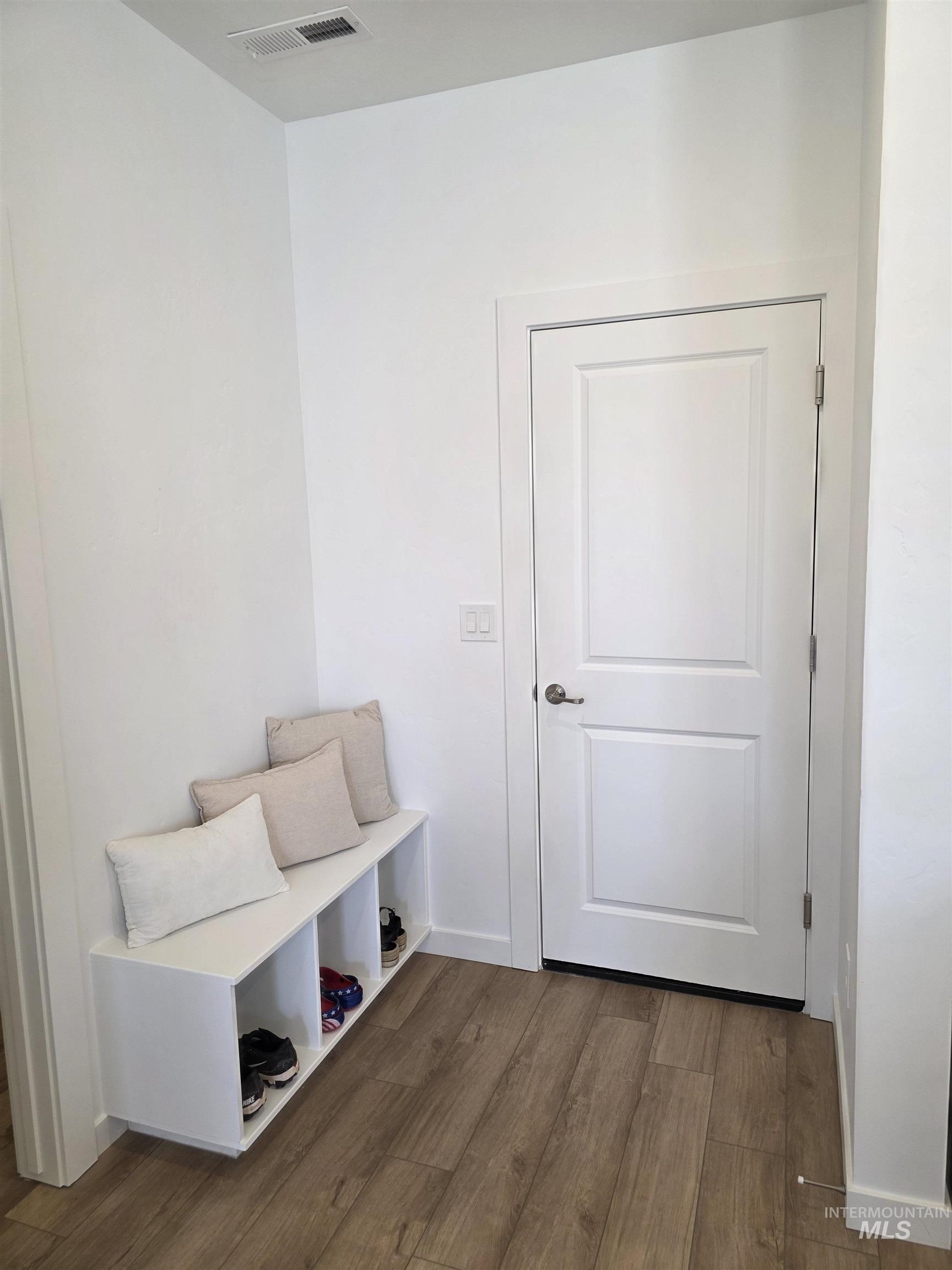 168 North Stratus Way Eagle, ID 83616 - Photo 16 of 35 Mudroom with dark wood-style flooring and baseboards