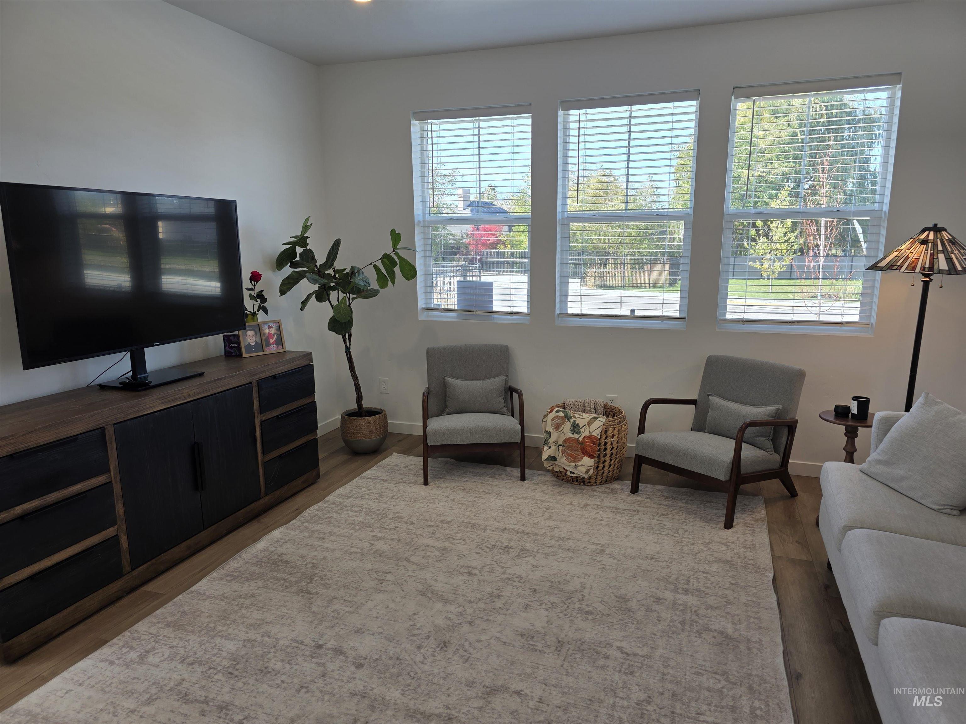 168 North Stratus Way Eagle, ID 83616 - Photo 19 of 35 Living area with wood finished floors