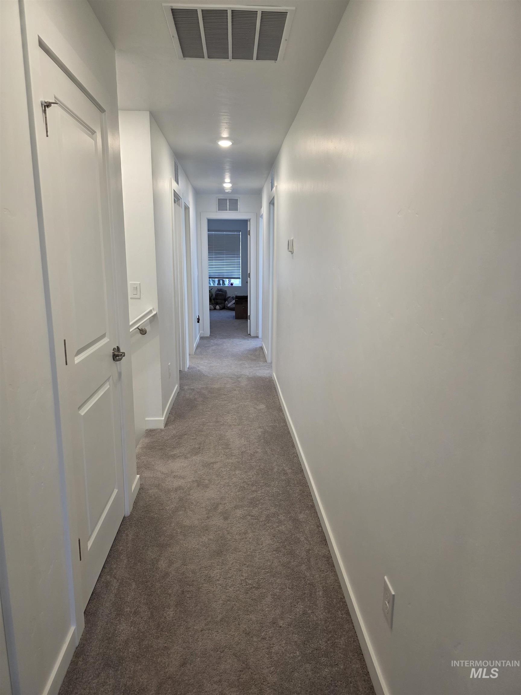 168 North Stratus Way Eagle, ID 83616 - Photo 23 of 35 Hall with carpet and baseboards