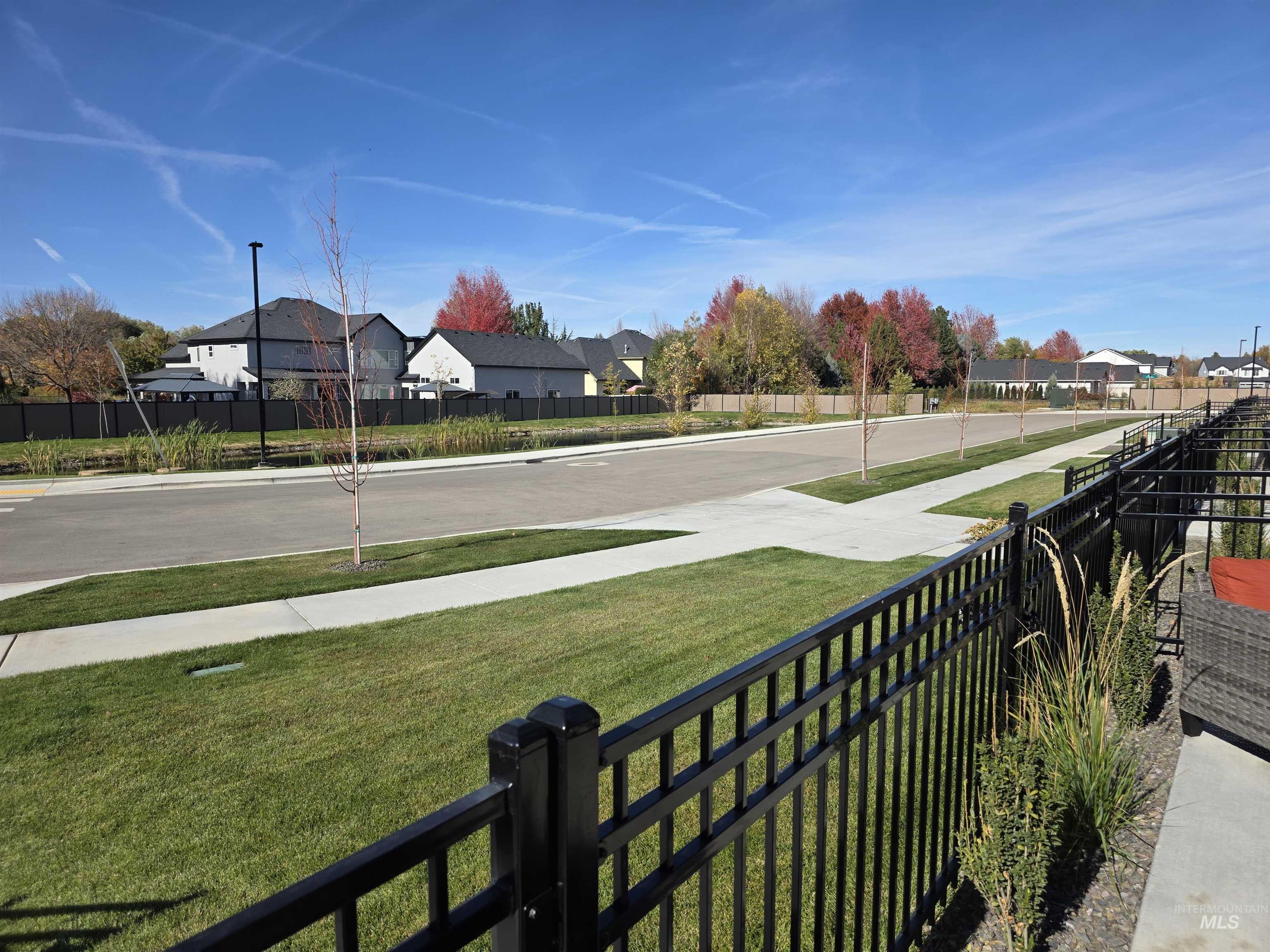 168 North Stratus Way Eagle, ID 83616 - Photo 31 of 35 View of pond and street parking.