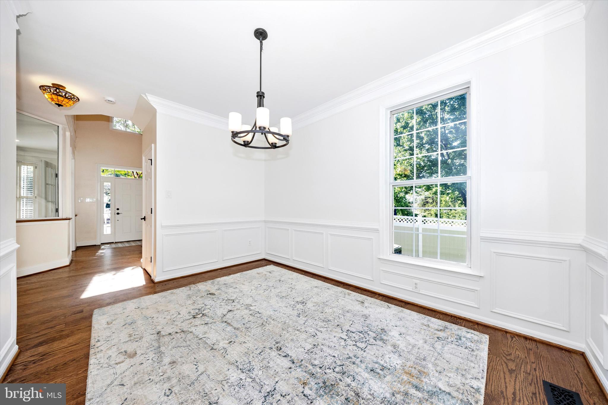 803 Apache Court Frederick, MD 21701 - Photo 6 of 46 en empty room with window and wooden floor