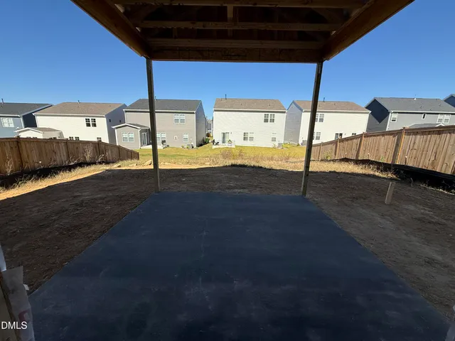 a view of a backyard of the house