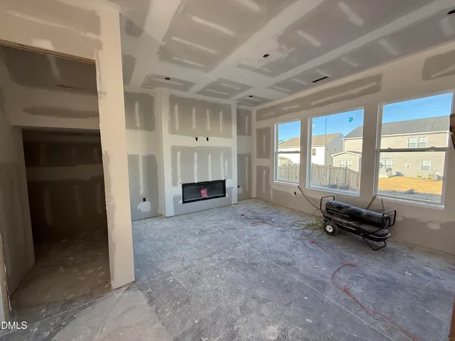 a view of kitchen with furniture and windows